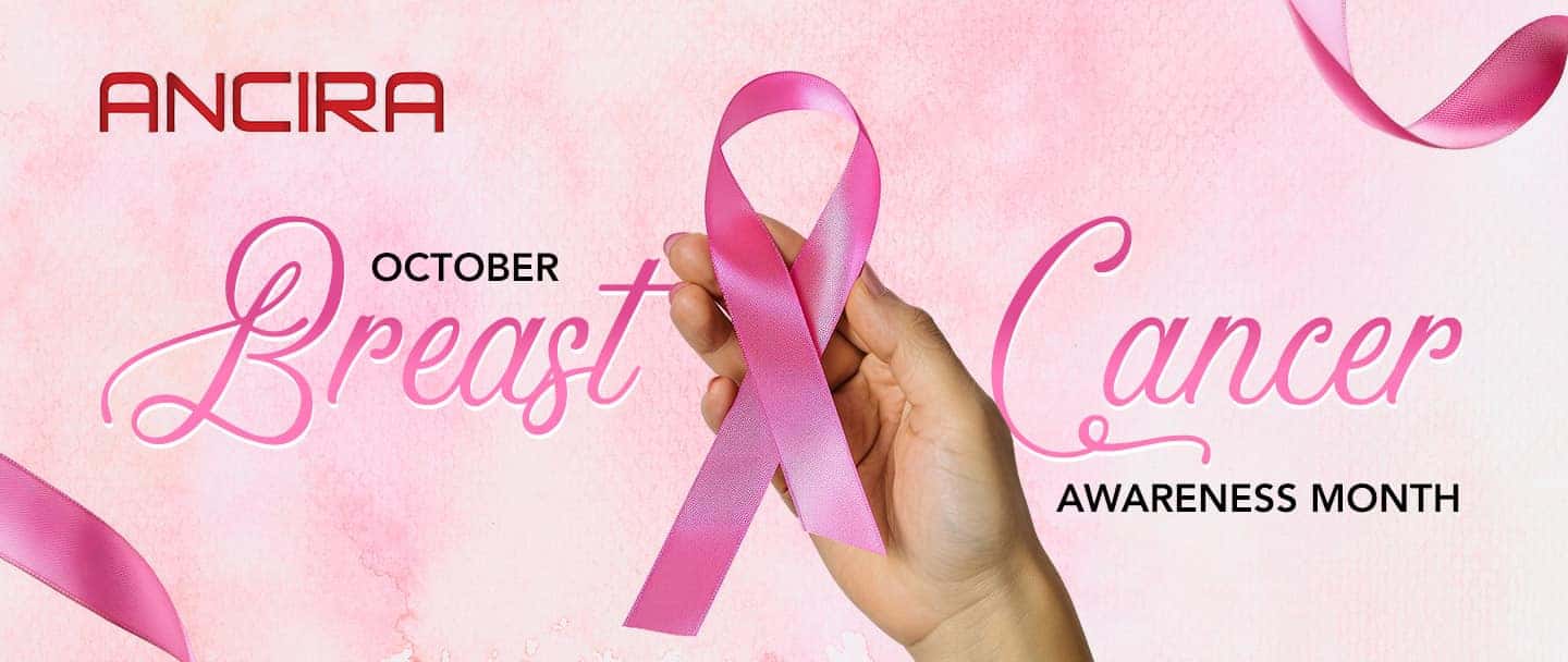 Pink Breast Cancer Awareness Month banner featuring a hand holding a pink awareness ribbon, with the Ancira logo and October Breast Cancer Awareness Month text on a soft pink background.