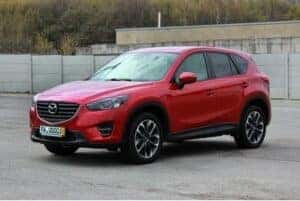 Red Mazda Cx5 parked in a parking lot