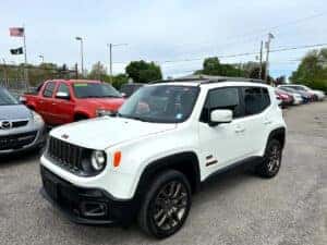 white jeep renegade in parking lot