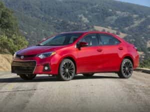red toyota corolla in the moutains