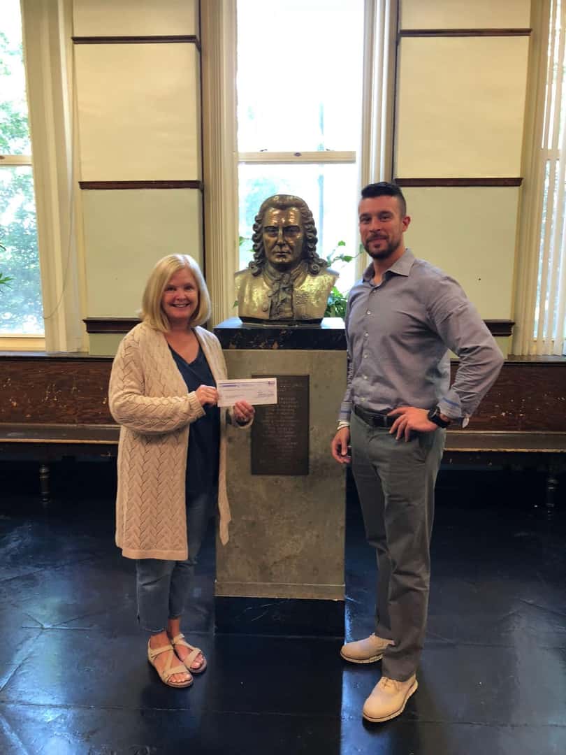 Service Manager Anthony DeJesus presents Car Wash Fundraiser check to Carl Von Linne Elementary School