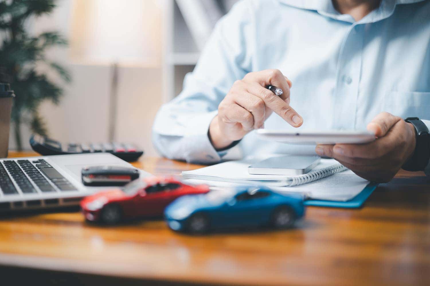 Chevrolet finance team member using ipad to review finance tools