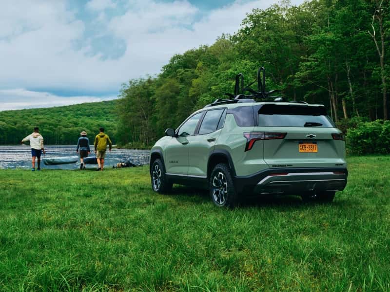 Chevy Equinox parked on banks of lake during outdoor day from Chevrolet Lease near Me