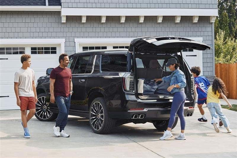 A family of four onboarding their Chevy Suburban and packing all their gear
