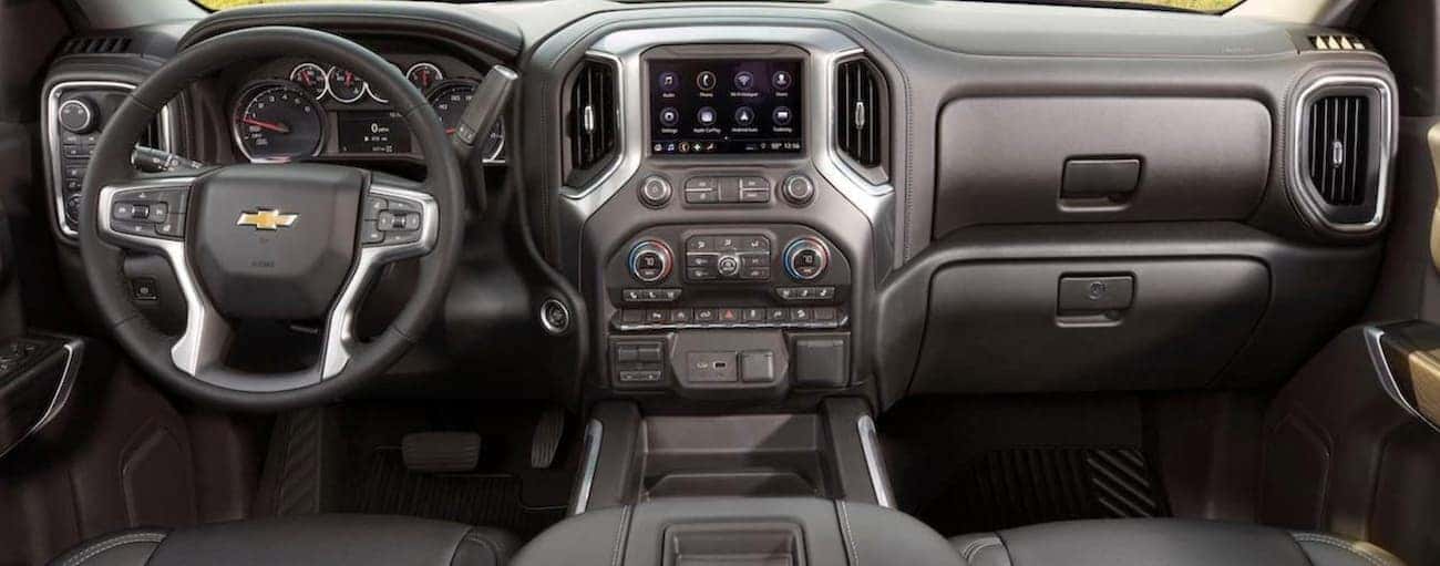 The dashboard and infotainment features on a 2020 Chevy Silverado 1500 are shown.