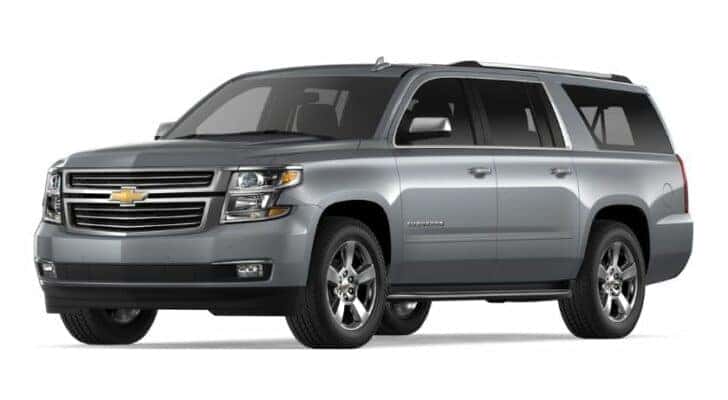 A silver 2018 Chevy Suburban LTZ is angled left,