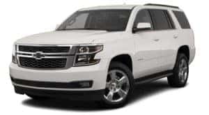 A white 2019 used Chevrolet Tahoe is angled left on a white background.