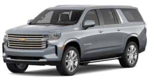 A silver 2021 Chevy Suburban is angled left.
