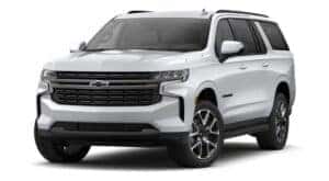 A white 2021 Chevy Suburban RST is angle left.