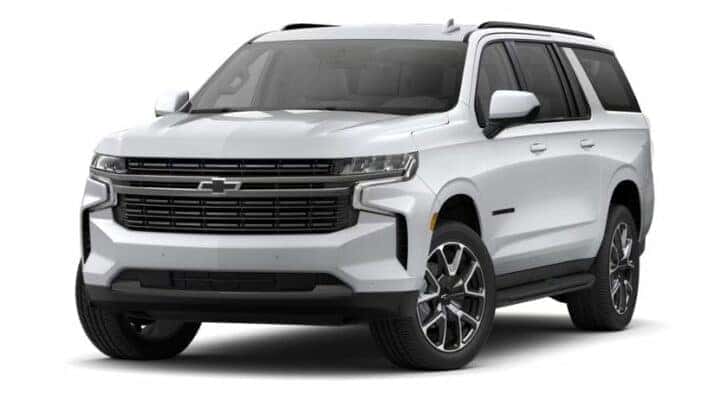 A white 2021 Chevy Suburban RST is angle left.