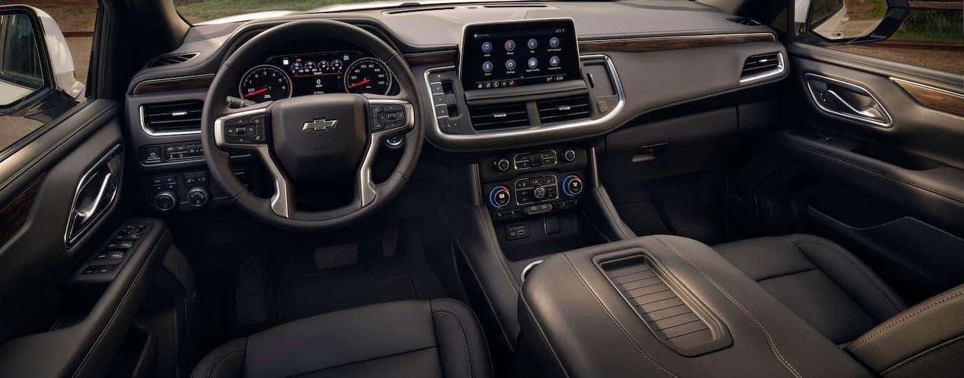 The interior front seats of a 2021 Chevy Tahoe are shown.