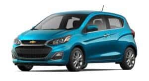 A teal 2021 Chevy Spark is angled left.