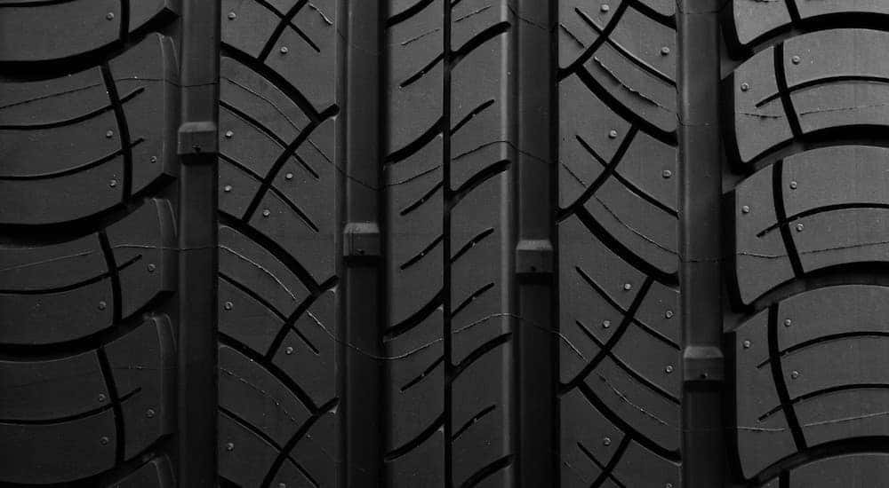 A close up shows the tread of a tire.