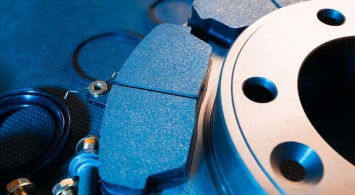 A close up shows a new rotor and brake pad at a brake shop in Indianapolis, IN.