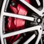 A close up shows a rad caliper and performance wheel.