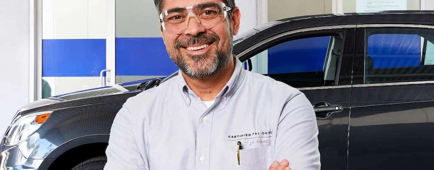A mechanic at a certified pre-owned Chevy dealer in Indianapolis is shown.