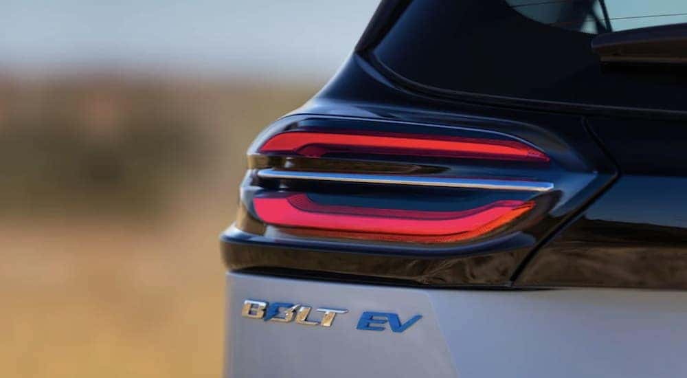 A blue 2022 Chevy Bolt EV is shown in close up after leaving a Greenwood Chevy dealer.