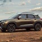 A gold 2022 Chevy Trailblazer is shown from the side parked in the mountains.