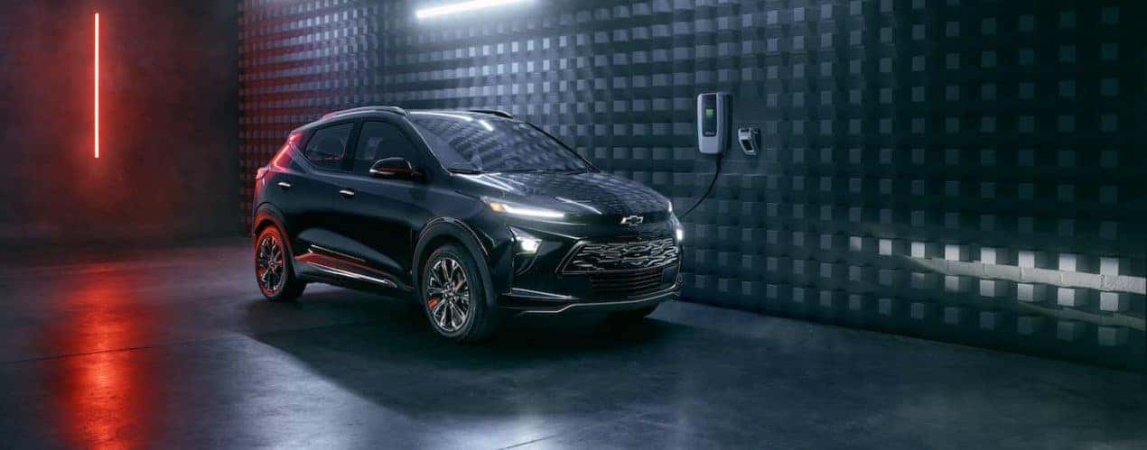 A black 2023 Chevy Bolt EUV Redline is shown charging.