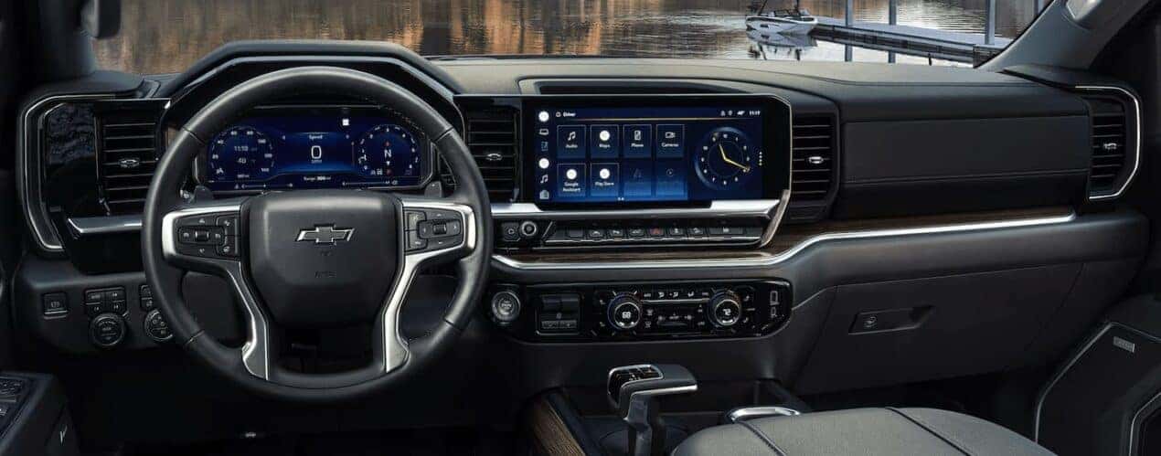 The black and silver accented interior of a 2023 Chevy Silverado 1500 is shown during a 2023 Chevy Silverado 1500 vs 2023 Ford F-150 comparison.