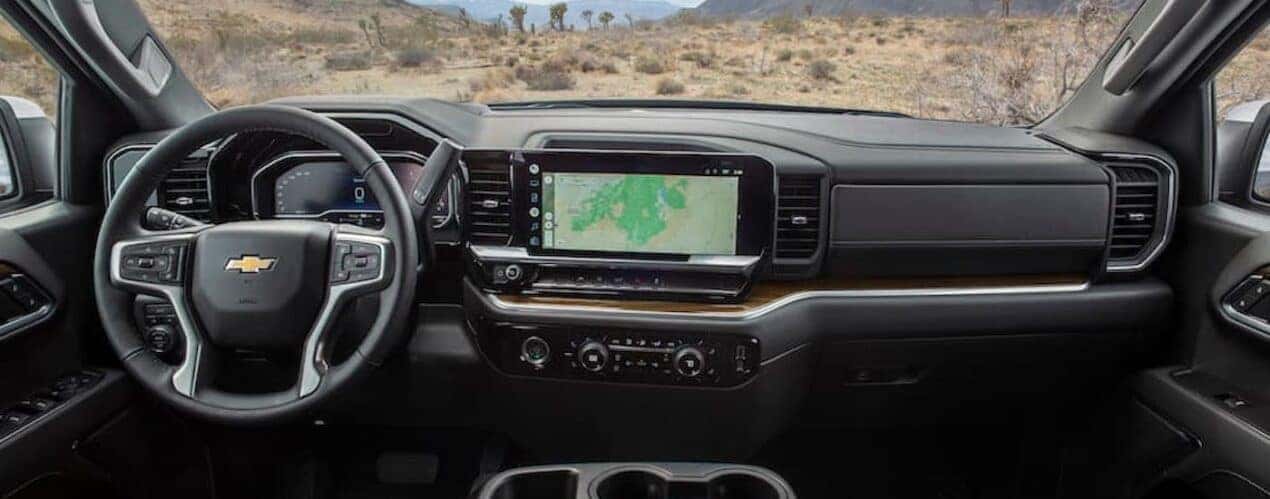 The black interior of a 2023 Chevy Silverado 1500 LT is shown from above the center console.