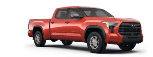 A red 2023 Toyota Tacoma is shown angled right.
