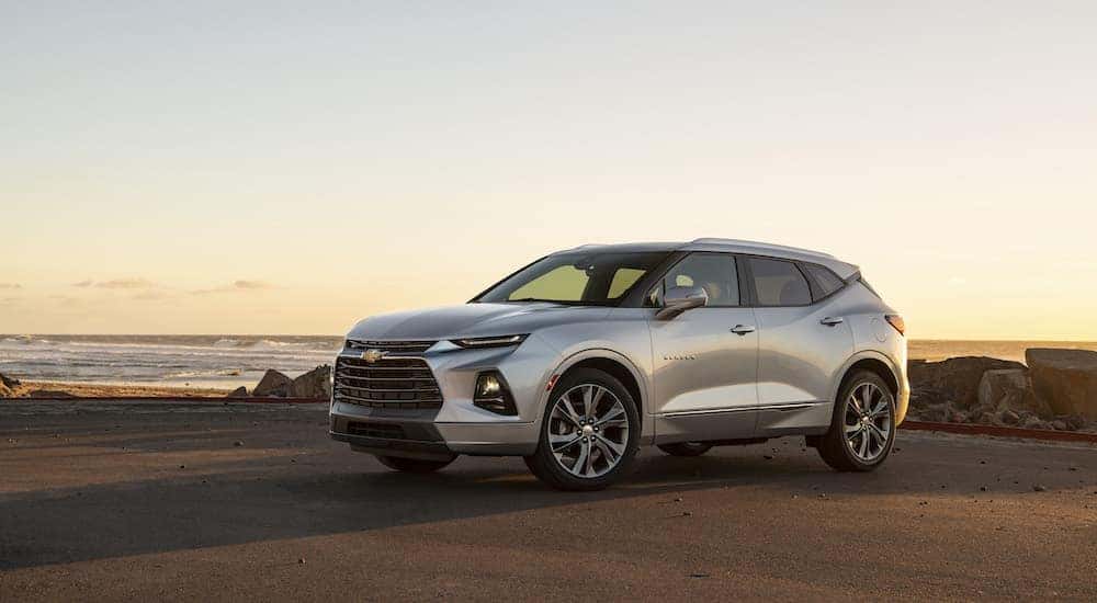 A silver 2019 Chevy Blazer is shown from the side while parked.