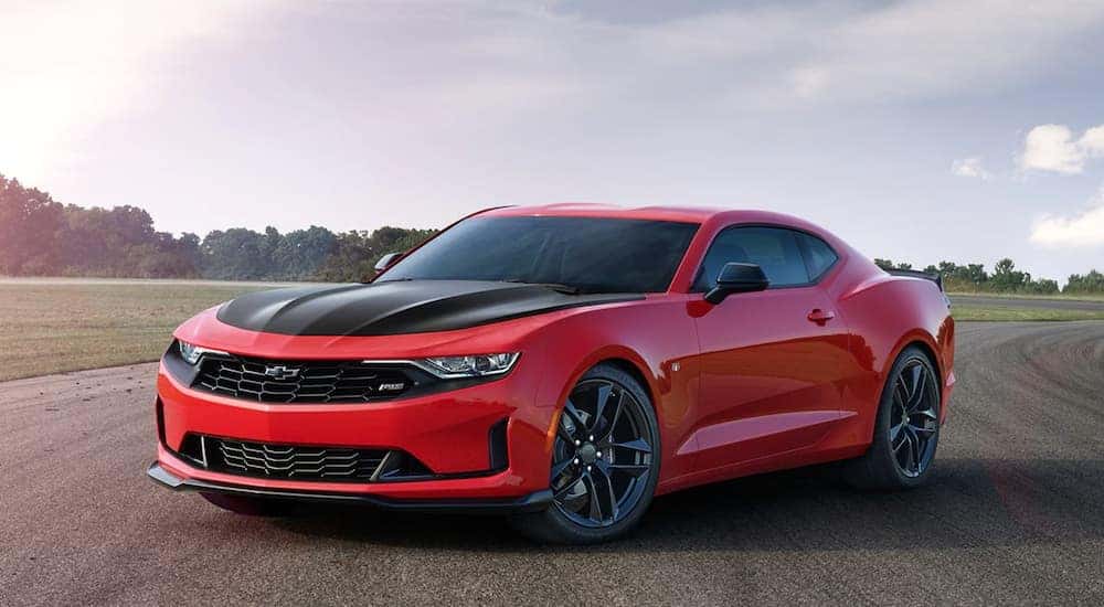 A red 2020 Chevy Camaro SS is shown from the front at an angle after leaving a Certified Pre-Owned Chevy dealer.