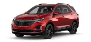 A red 2024 Chevy Equinox is angled left.