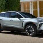 A silver 2024 Chevy Blazer EV parked on a side street.