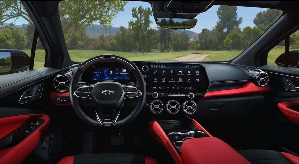 The red and black front seats of a 2024 Chevy Blazer EV RS.