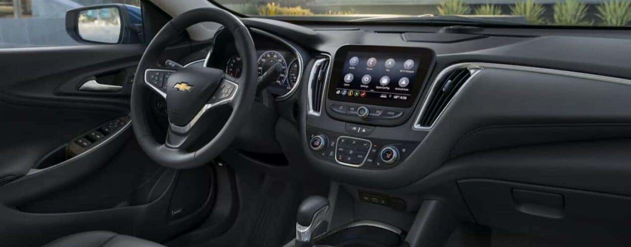 The black interior and dash in a 2024 Chevy Malibu is shown.