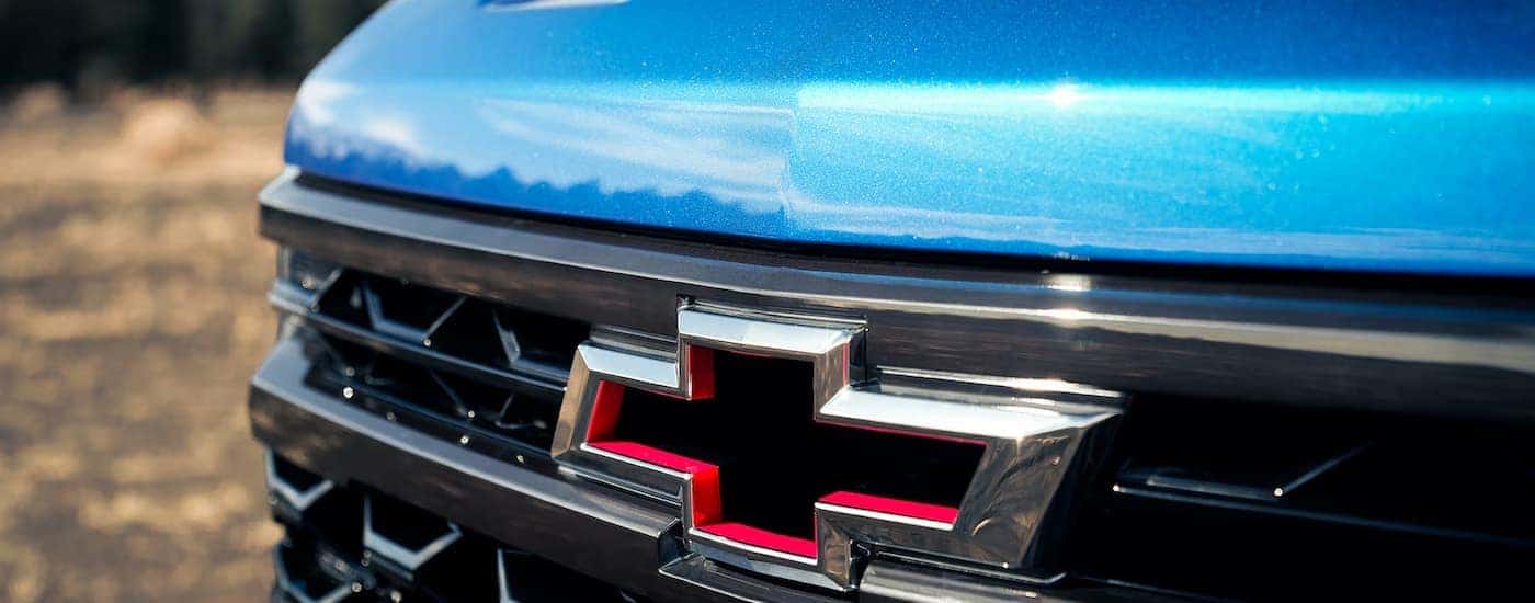 A close up of the grille on a blue 2024 Chevy Silverado 1500 ZR2 for sale.