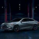 A silver 2025 Chevy Malibu Redline is shown from the front at an angle.