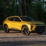 A yellow 2024 Chevy Trax ACTIV is shown from the front at an angle.