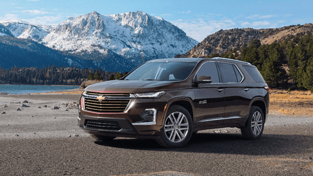 2022 Chevy Traverse High Country parked along a mountain side lake