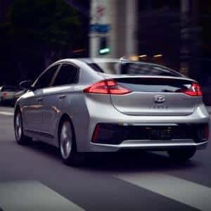 Hyundai Ioniq driving down a street