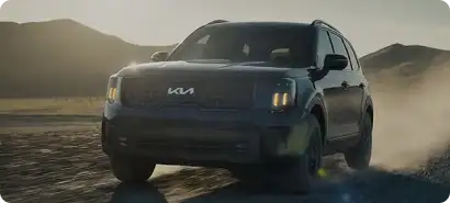 2027 Kia Telluride driving on a dirt path