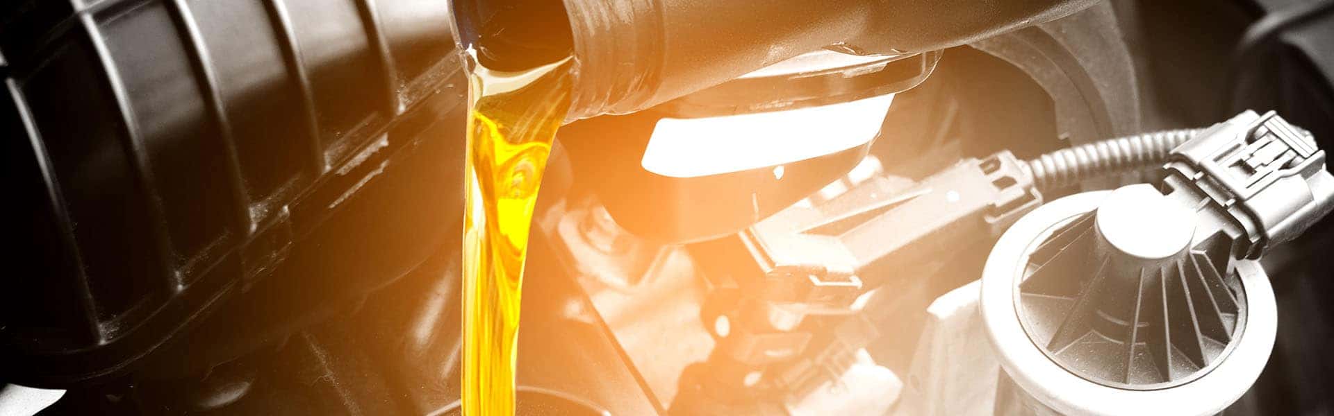 Refueling and pouring oil quality into the engine motor car Tran