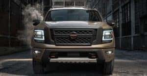 A tan 2020 Nissan Titan is shown from the front after leaving a used truck dealer in Louisville.
