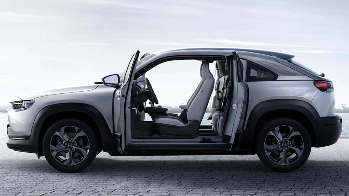 2022 Mazda MX-30 EV on a boating dock with its freestyle doors open 