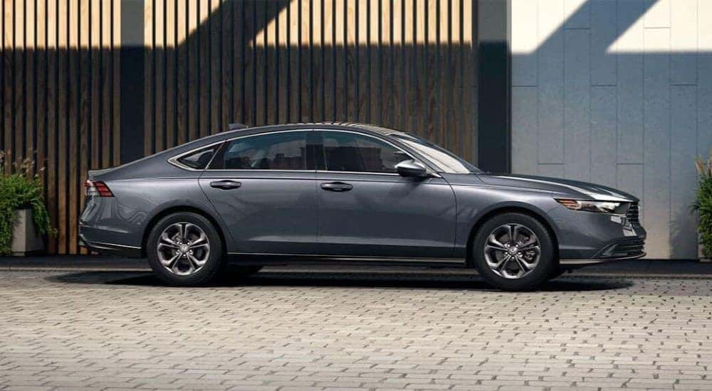 A grey 2023 Honda Accord EX is shown from the side.