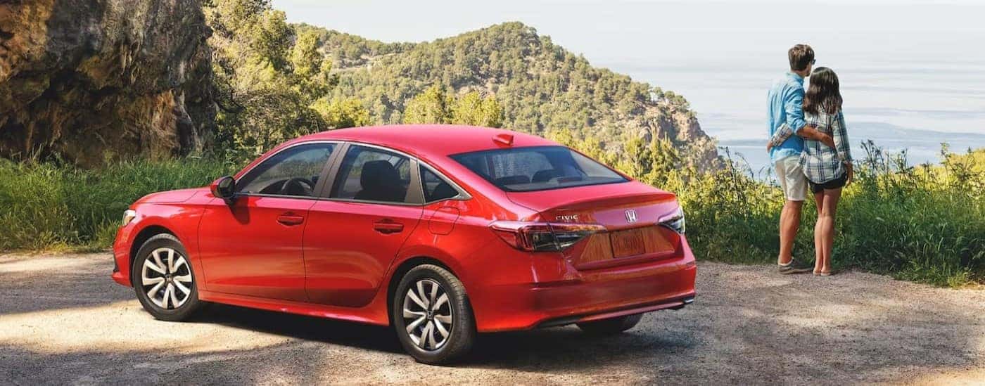 A red 2024 Honda Civic LX is shown parked.