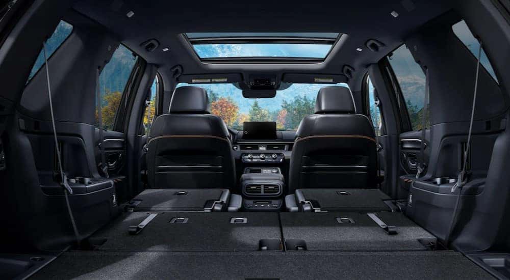 The black interior and cargo area in a 2024 Honda Pilot for sale is shown.