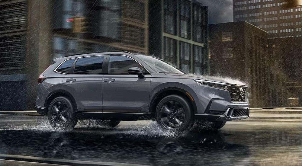 A grey 2025 Honda CR-V is shown from the side.