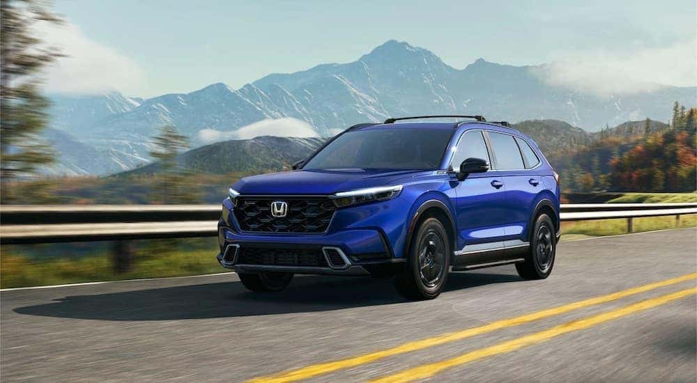 A blue 2025 Honda CR-V is shown from the front at an angle after leaving a Honda dealer near Norman.