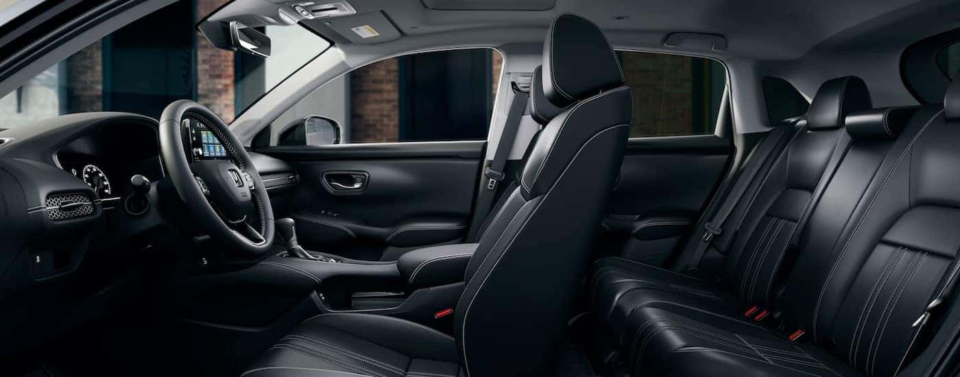The black interior and dash in a 2024 Honda HR-V EX-L is shown.