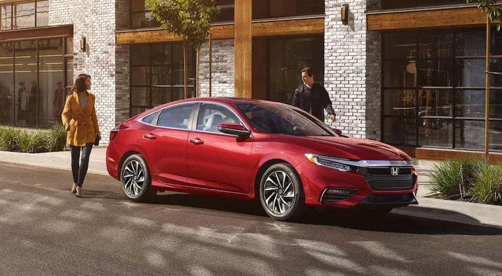 A red 2021 Honda Insight is shown from the side.