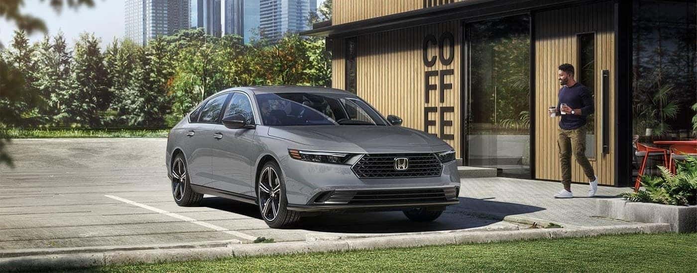 A grey 2025 Honda Accord is shown from the front at an angle.
