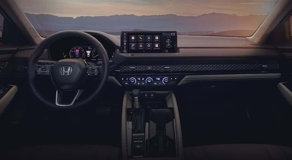 The black and gray interior and dash are shown in a 2023 Honda Accord.